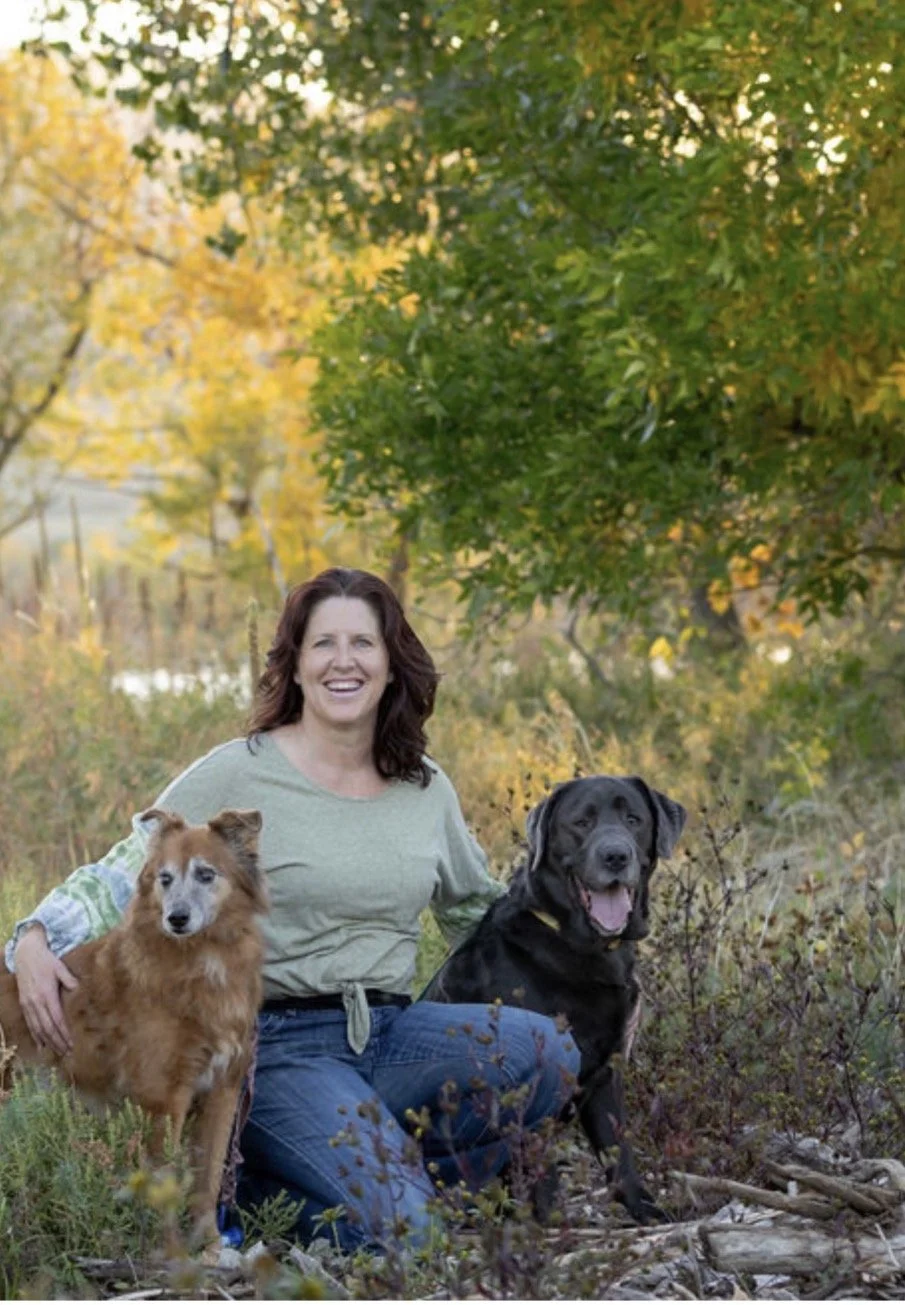 Patti Fluegel, certified canine massage therapist, with her dogs